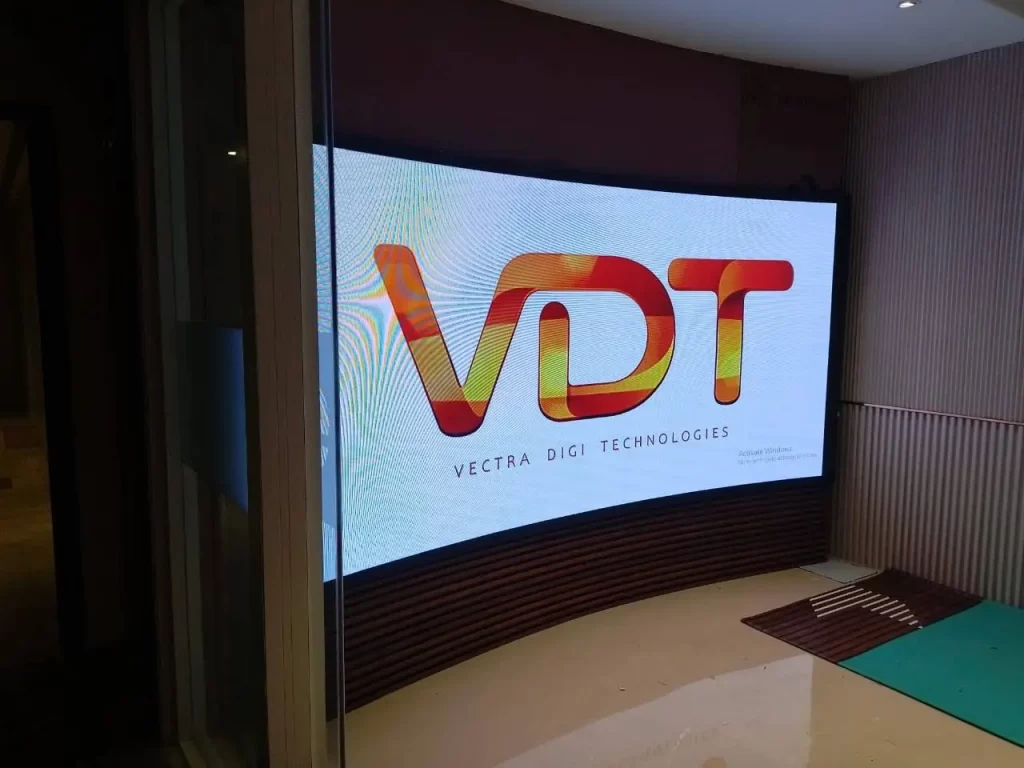 Curved LED digital display showing VectraDigi Technologies logo at corporate office.