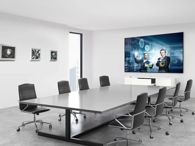 Conference room with digital display setup for presentations and video meetings.