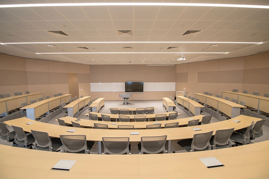 University auditorium with digital display screen for education.