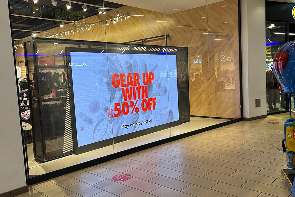 High-resolution indoor digital display signage showing 50% off sale