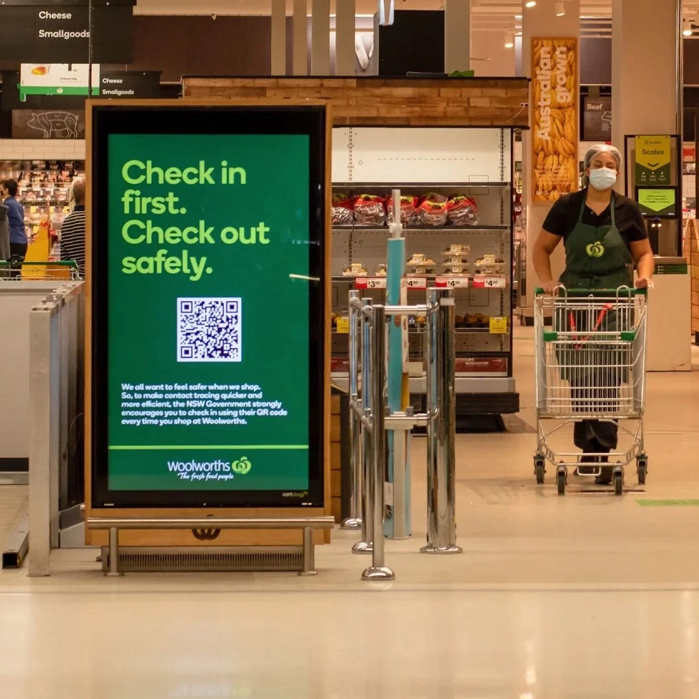 Indoor digital display showing content with content management system in a grocery store.