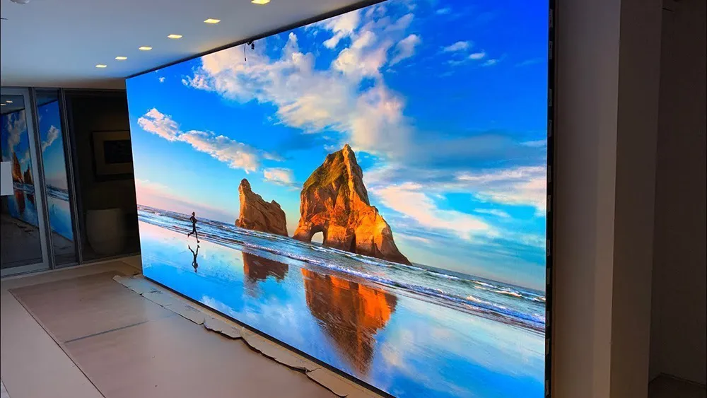 Indoor LED display screens displaying a mountain scenery inside a shopping mall.