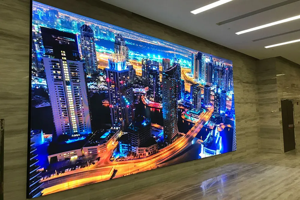 LED screen panel for indoor spaces displaying a city landscape.