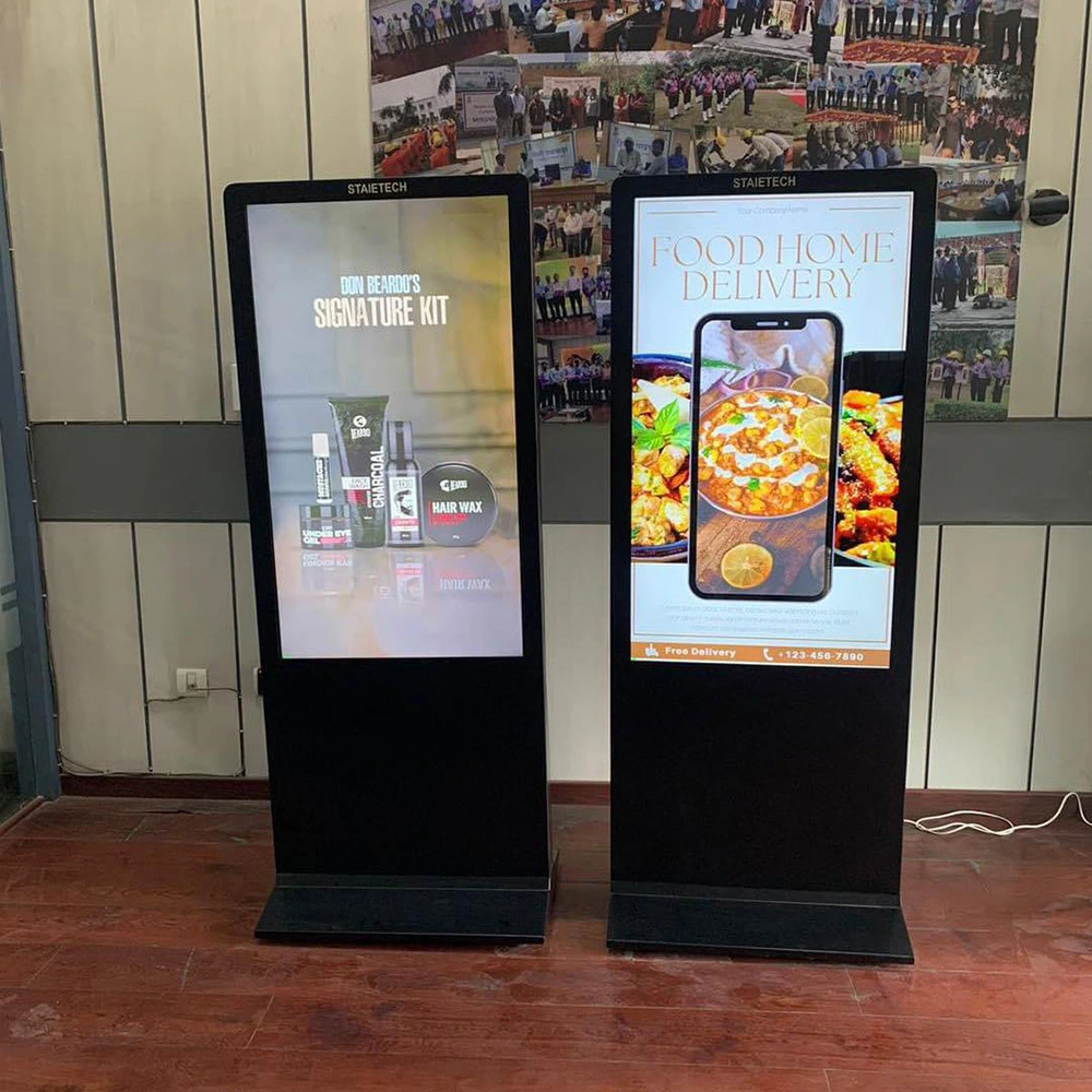 Modern digital signage displays in India with dual vertical LED screens showing advertising content.