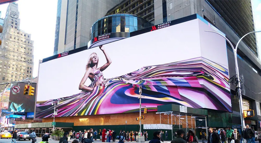 Outdoor Active LED display screen wall for brand advertising on a busy street in India.
