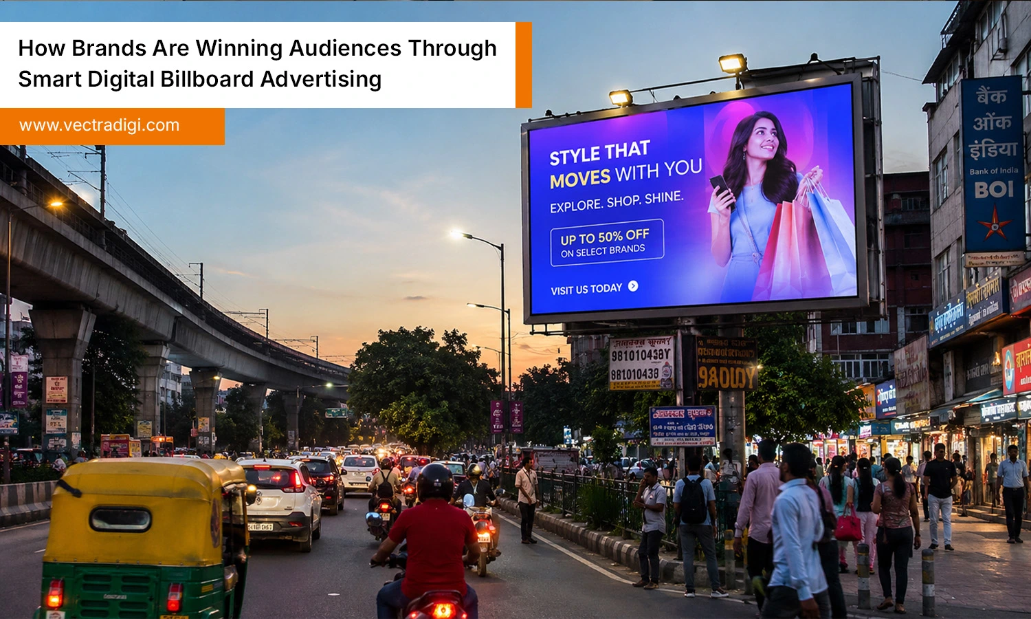 Digital billboard advertising display on busy Indian city road with bright LED outdoor screen view