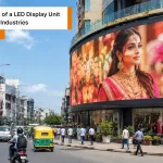 Indian city street showcasing a led display unit for digital advertising in a vibrant commercial area.