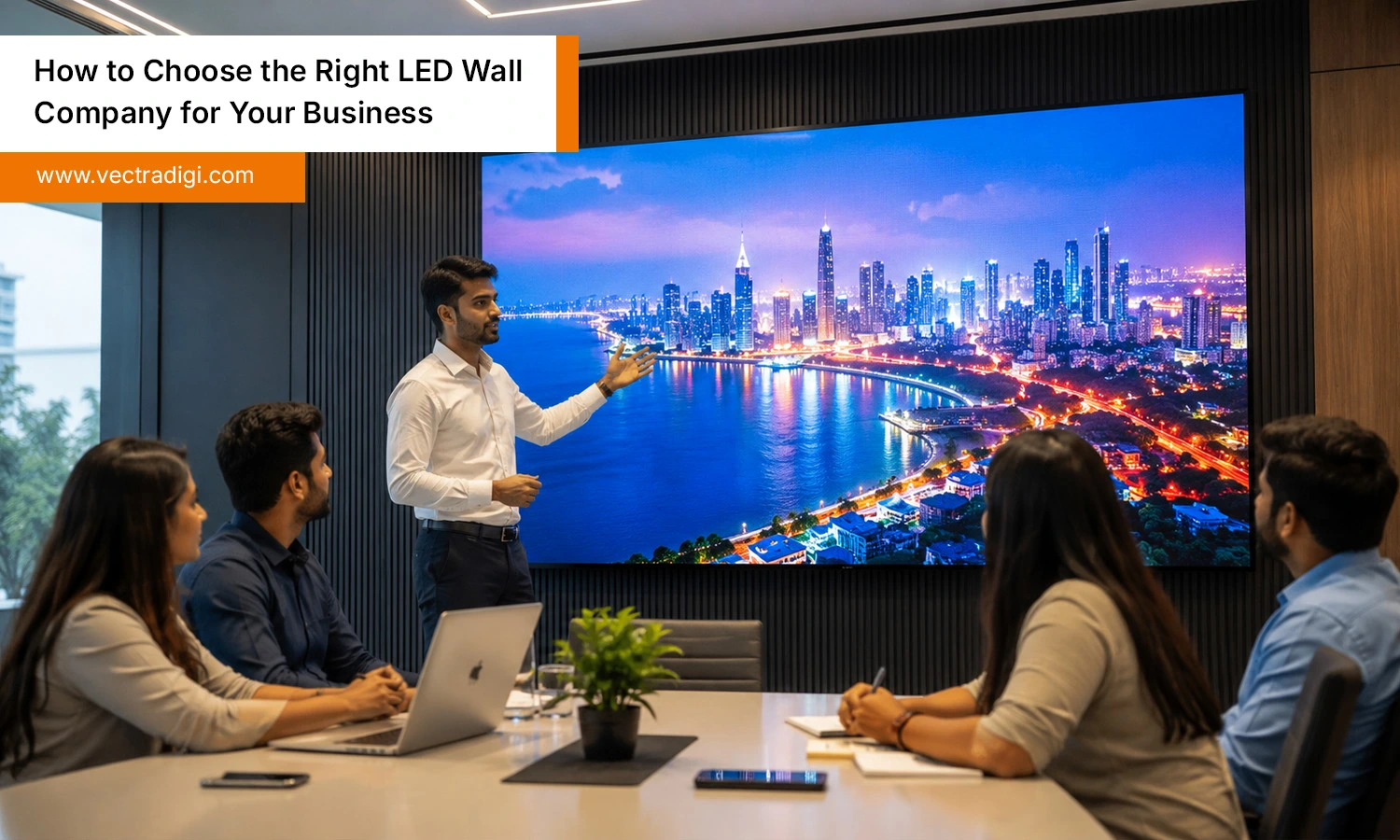 Indian business professionals evaluating a premium LED display solution from a trusted LED wall company in a modern corporate office.
